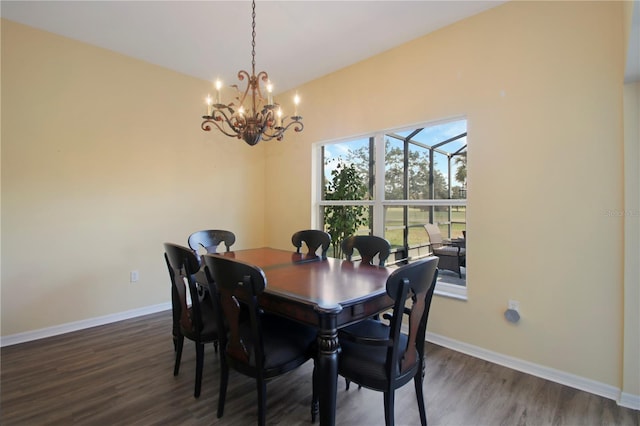 dining room featuring a chandelier and dark hardwood / wood-style floors