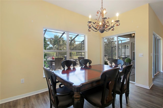 dining area featuring dark hardwood / wood-style floors and a notable chandelier