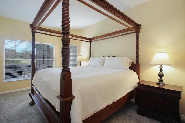 carpeted bedroom featuring beam ceiling