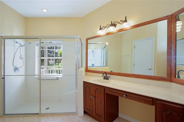 bathroom featuring tile patterned flooring, vanity, and an enclosed shower