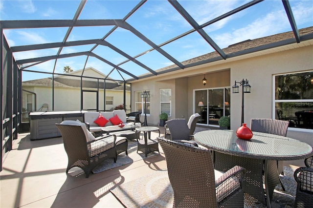 view of patio featuring an outdoor living space, a hot tub, and a lanai