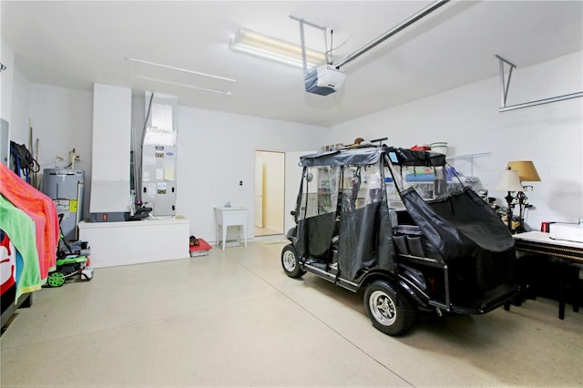 garage featuring electric water heater and a garage door opener