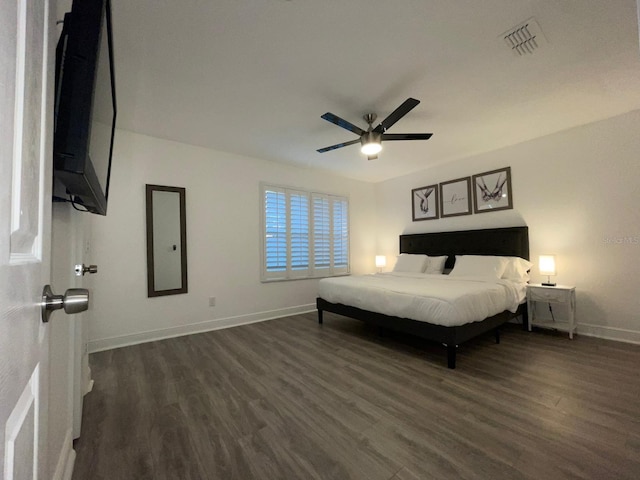 unfurnished bedroom featuring ceiling fan and dark wood-type flooring