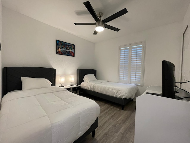 bedroom with ceiling fan and hardwood / wood-style flooring