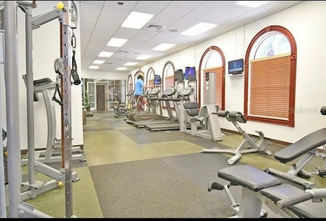 workout area with a drop ceiling