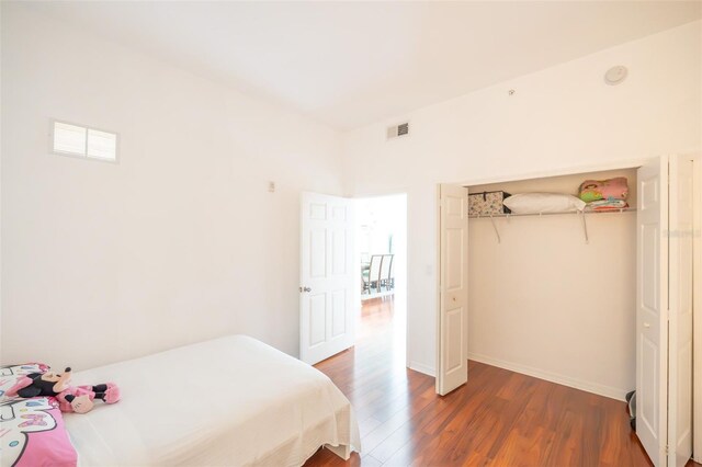 bedroom featuring dark hardwood / wood-style floors