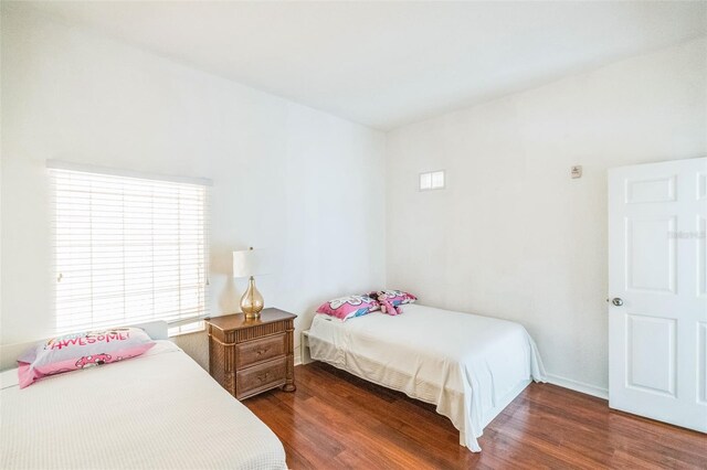 bedroom featuring dark hardwood / wood-style flooring