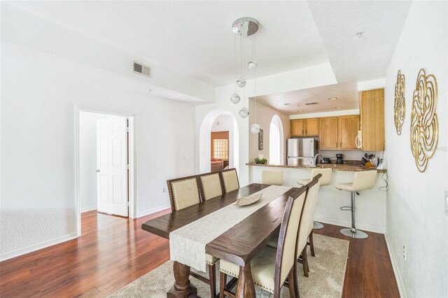 dining area featuring dark hardwood / wood-style flooring