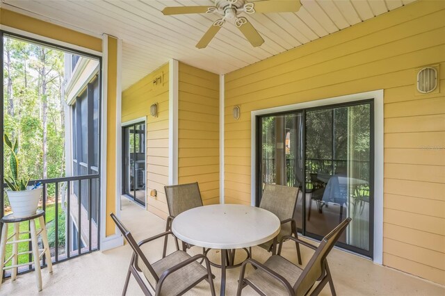 exterior space featuring ceiling fan and a healthy amount of sunlight