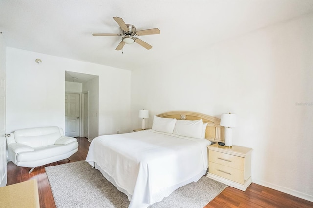 bedroom featuring ceiling fan and dark hardwood / wood-style flooring