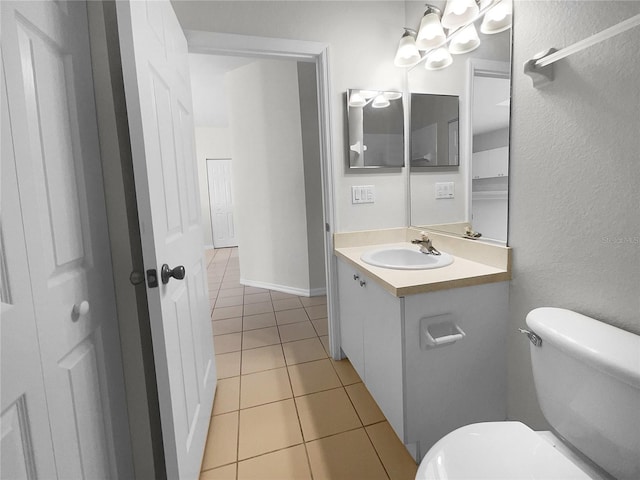 bathroom featuring vanity, toilet, and tile patterned floors