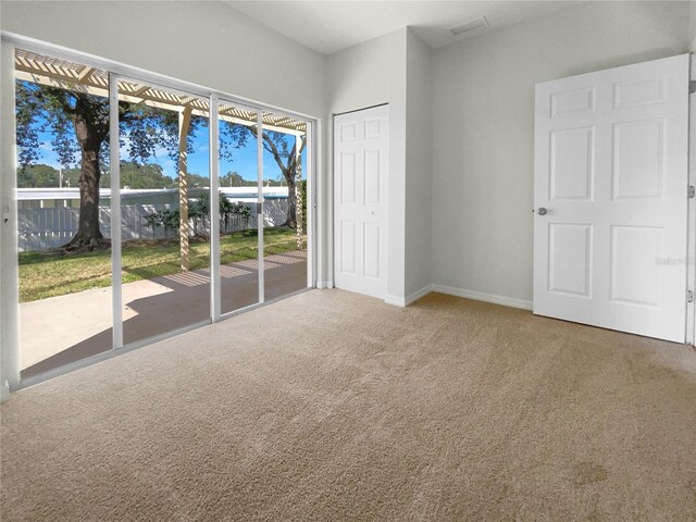 empty room with carpet flooring