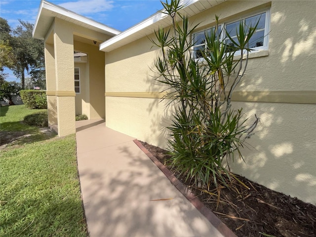 view of property exterior with a yard