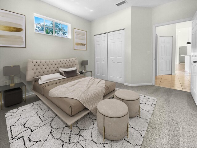 bedroom featuring carpet and a closet