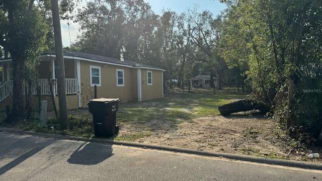 1517 S Campbell St, Perry, FL 32348 - view of property exterior featuring stucco siding