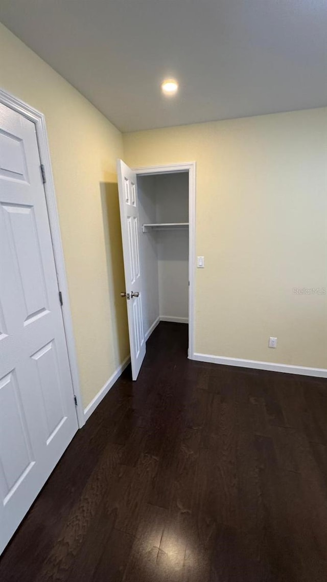 1517 S Campbell St, Perry, FL 32348 - unfurnished bedroom with dark wood-style floors, recessed lighting, and a closet