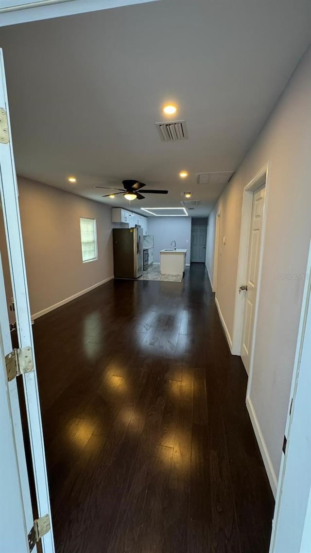 1517 S Campbell St, Perry, FL 32348 - hallway featuring dark wood-style floors and recessed lighting