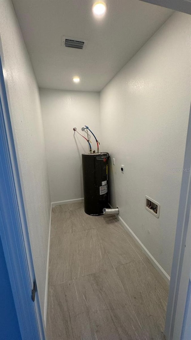 1517 S Campbell St, Perry, FL 32348 - laundry area featuring water heater, electric dryer hookup, recessed lighting, and hookup for a washing machine