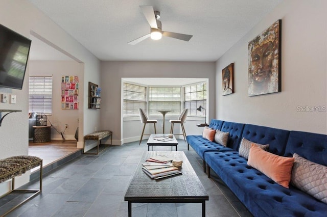 living room featuring ceiling fan