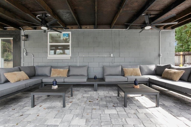 exterior space with ceiling fan and an outdoor hangout area