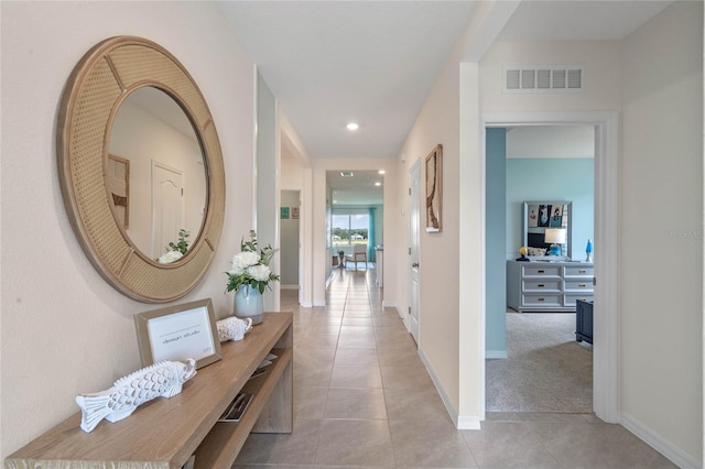 hallway with light tile patterned floors