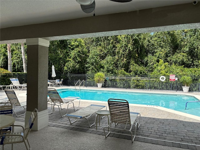 view of swimming pool with a patio