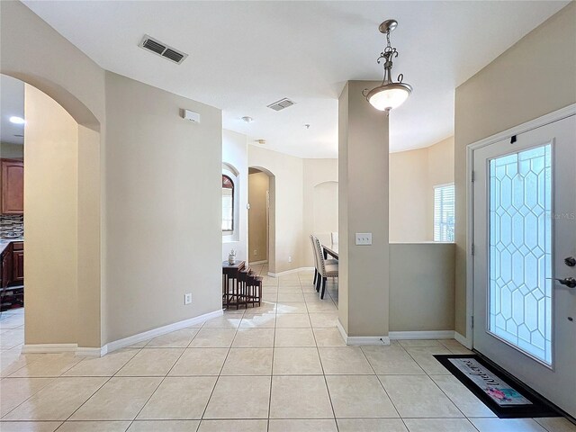 foyer featuring light tile patterned floors