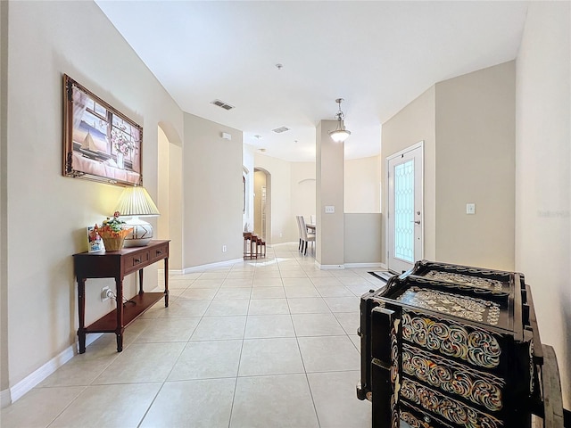 452 Harbor Winds Ct, Winter Springs, FL 32708 - hallway with arched walkways, baseboards, visible vents, and light tile patterned flooring