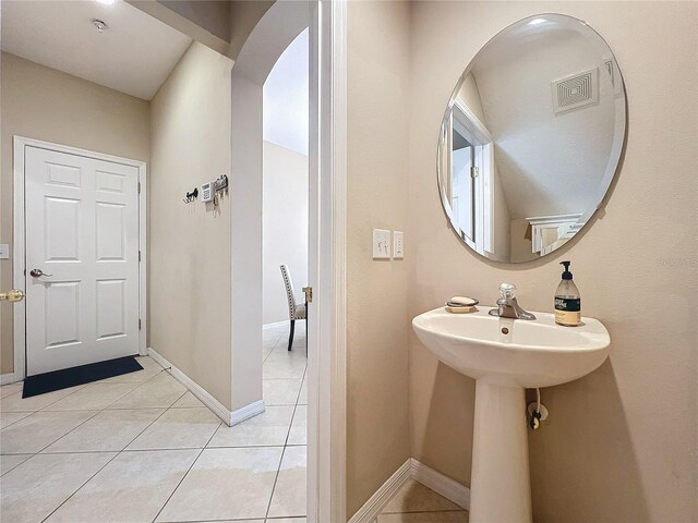 bathroom with tile patterned flooring