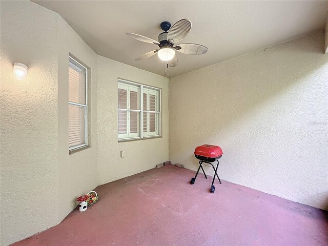 view of patio featuring ceiling fan