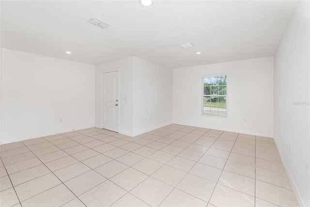 spare room with light tile patterned floors