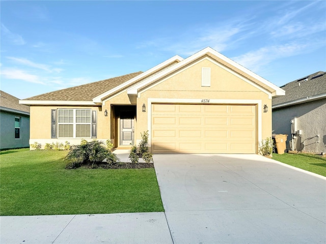 ranch-style home featuring a garage, driveway, a front yard, and stucco siding