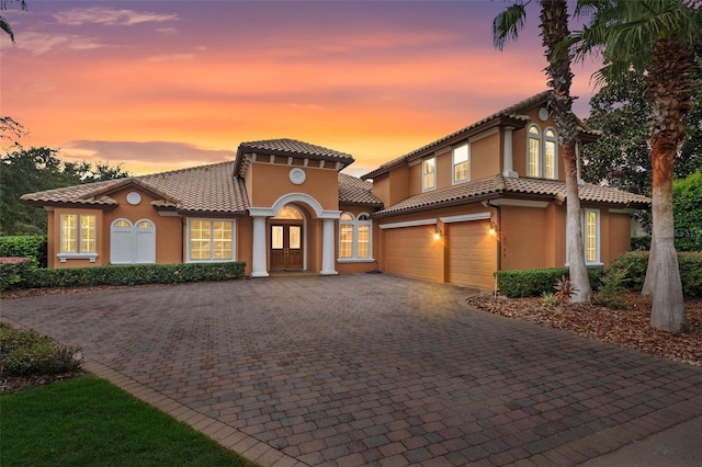 mediterranean / spanish-style home featuring a garage