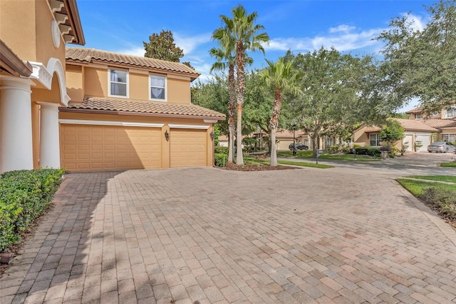 view of property exterior with a garage