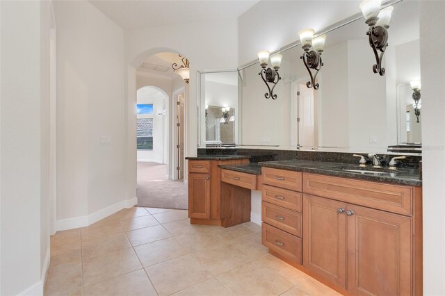 bathroom with tile patterned flooring and vanity