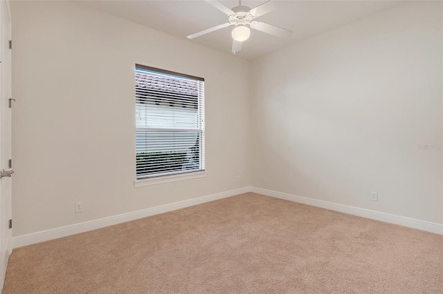 unfurnished room with light carpet and ceiling fan