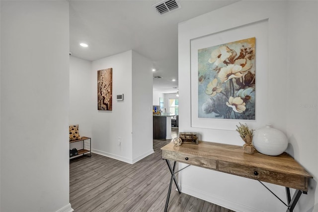 corridor featuring light hardwood / wood-style floors