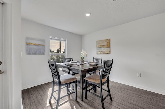 dining room with hardwood / wood-style flooring