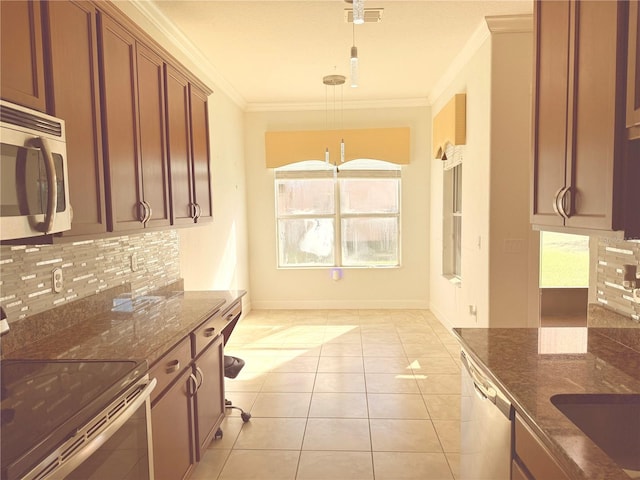 kitchen featuring backsplash, crown molding, decorative light fixtures, electric range, and dishwashing machine