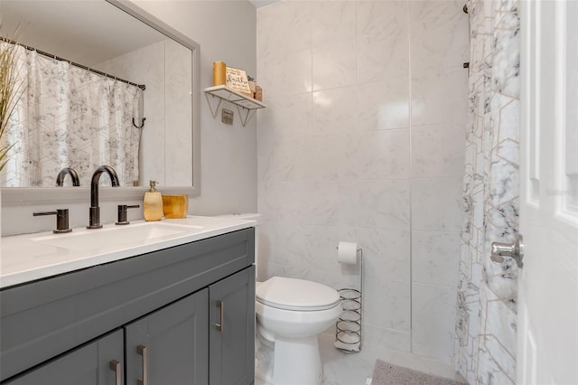 bathroom featuring tile walls, toilet, vanity, and a shower with curtain