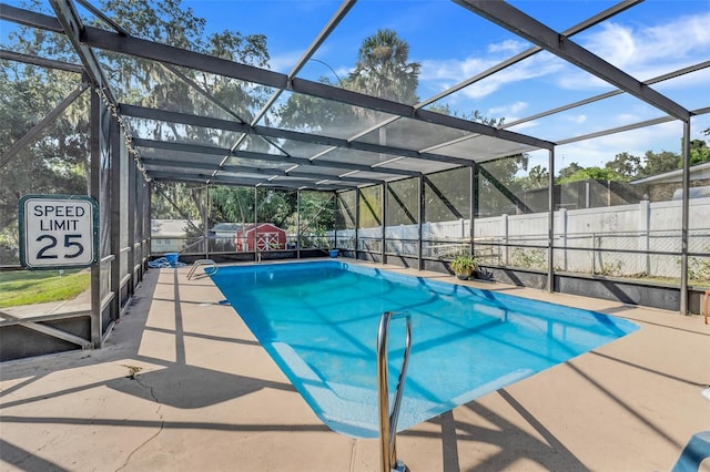 view of pool with a patio area, a fenced in pool, a lanai, and fence