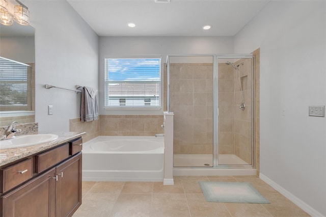 bathroom with vanity, shower with separate bathtub, and tile patterned flooring