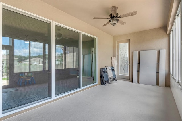 exterior space featuring ceiling fan