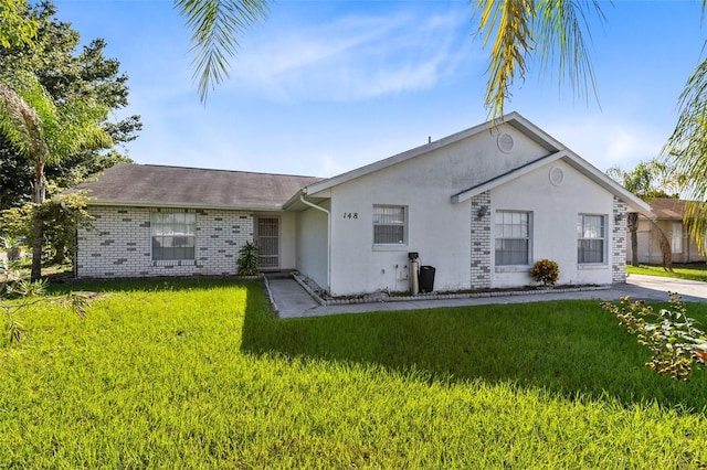 view of front of home with a front lawn