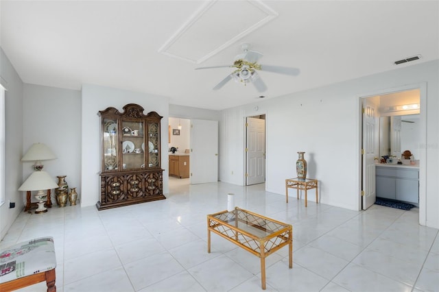 living room featuring ceiling fan and light tile patterned floors