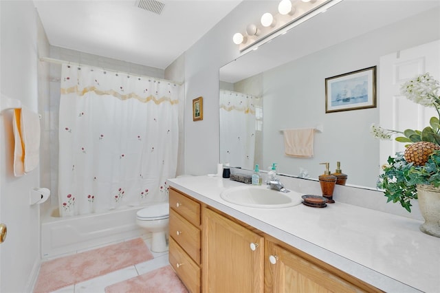 full bathroom featuring vanity, tile patterned floors, toilet, and shower / bath combo