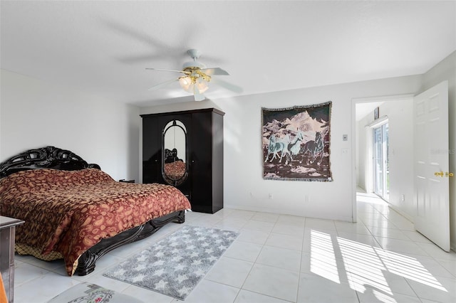 tiled bedroom featuring ceiling fan