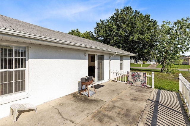 148 Merida Dr, Kissimmee, FL 34743 - view of patio / terrace with a grill and fence