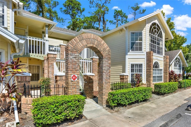 view of front of house with a balcony