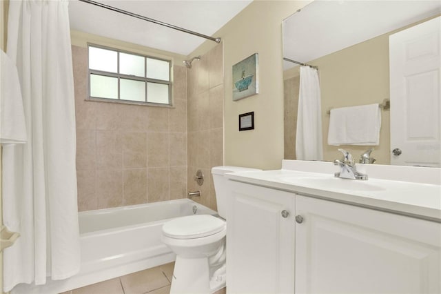 full bathroom with shower / tub combo with curtain, tile patterned floors, vanity, and toilet